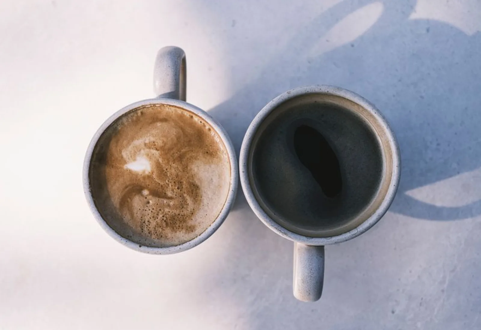 Two baristas working the bar during service